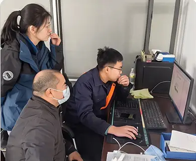 Engineers reviewing machine quality